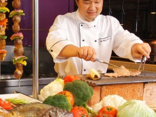 Chef in a restaurant cooking in a kitchen.