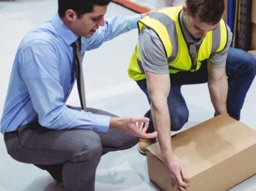 Man trying to lift a box